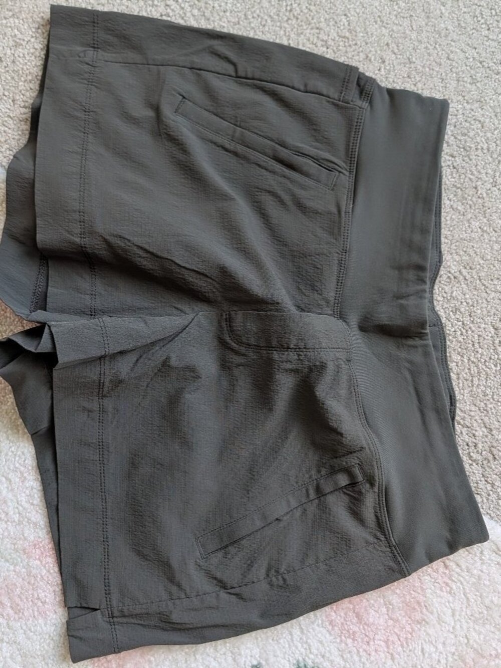 Athleta Trekkie North Mid Rise Shorts in a dark grayish color